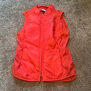 Bright red zip up Nike running vest with two zippered pockets size small